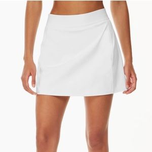 TnaSLICK™ Court Mini Skirt